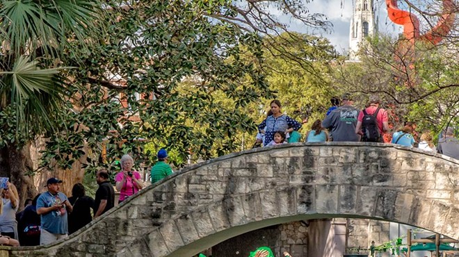 Revelers take part in one of San Antonio's St. Patrick's Day river parades.