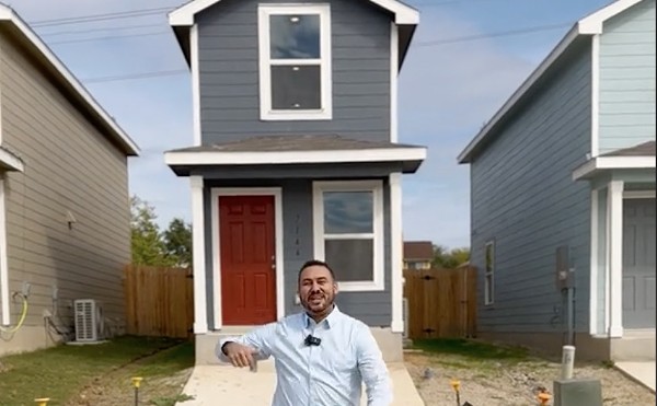 Realtor Billy Rojo stands in front of a tiny home for sale in Northwest San Antonio.