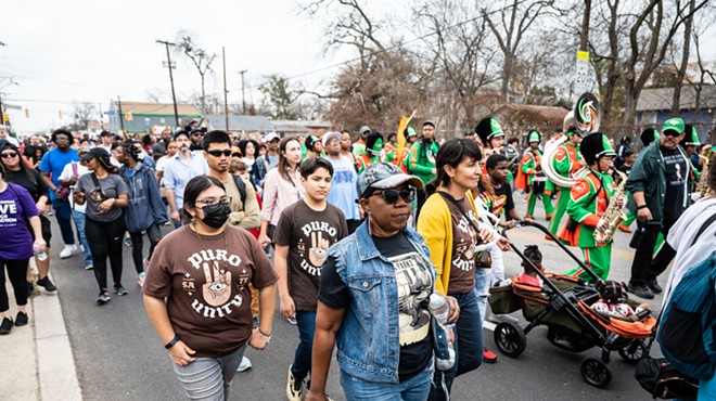 Participants in a previous Martin Luther King Jr. March move along the route.