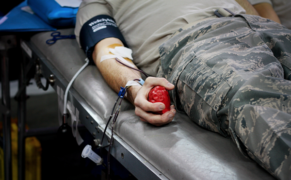 A service member donates blood.