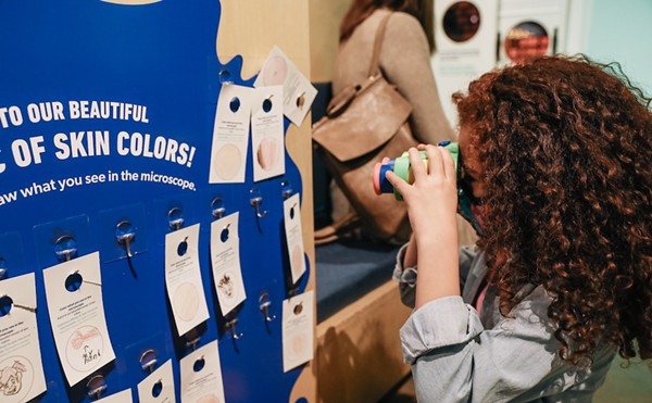 A museum visitor learns about skin pigment at San Antonio's DoSeum.