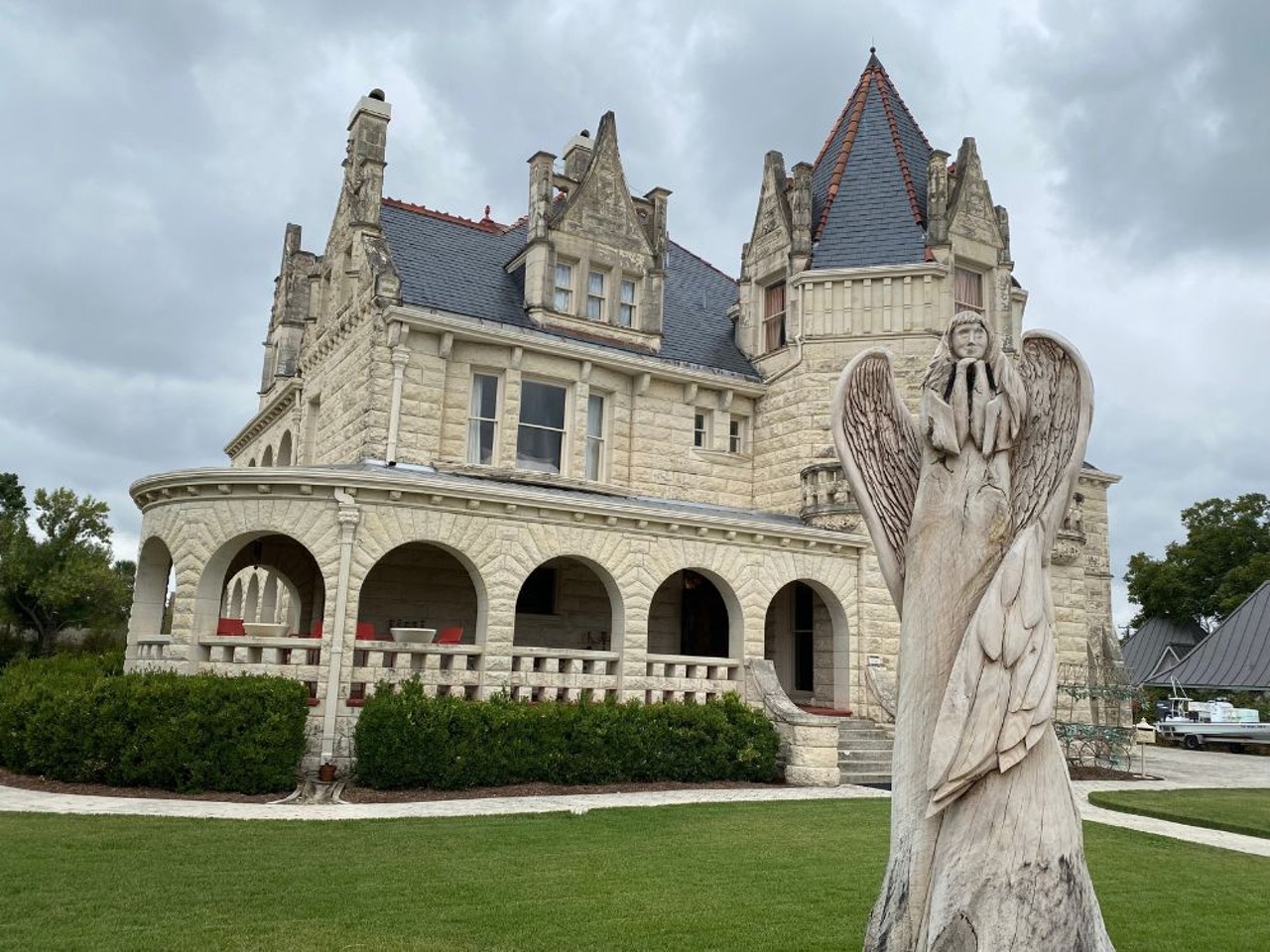 Terrell Castle, a.k.a. The Lambermont
Now home to a fancy wedding venue, this historic building was built for the influential Edwin Holland Terrell and fashioned after European castles, but its eerie history has led to its haunted reputation. The property remained a source of pride until Terrell’s suicide in 1910 after years of suffering with syphilis. Unfortunately, his initial attempt failed, and it took him 10 days to die. Other tragic tales associated with the mansion include a contractor who threw himself from a balcony during construction, and a man who killed his wife and her lover when he caught them in bed together during World War II. Fortunately, the 12,000-square-foot building is expansive enough to accommodate plenty of guests, so couples shouldn’t be too worried about ghastly wedding crashers.