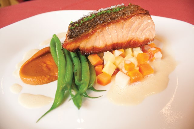 Scottish salmon and root vegetable brunoise, with Haricots verts finished in fines herbes from McCullough Avenue Grill. - VERONICA LUNA