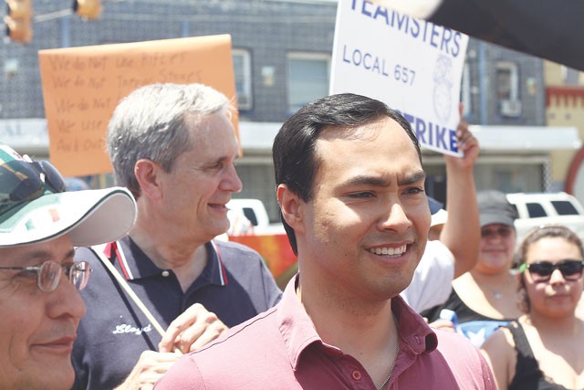 State Rep. Joaquin Castro and Austin-based Congressman Lloyd Doggett, both of whom have announced they’re running for a newly formed congressional stretching through San Antonio, march at a July Fourth immigrant rights rally on the city’s Westside. - MICHAEL BARAJAS