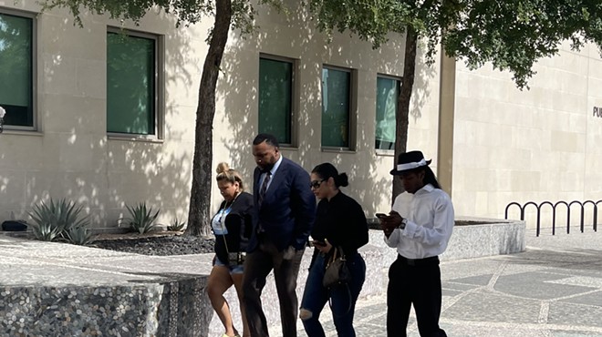 Civil rights attorney Lee Merritt (second from left) approaches for a press conference.