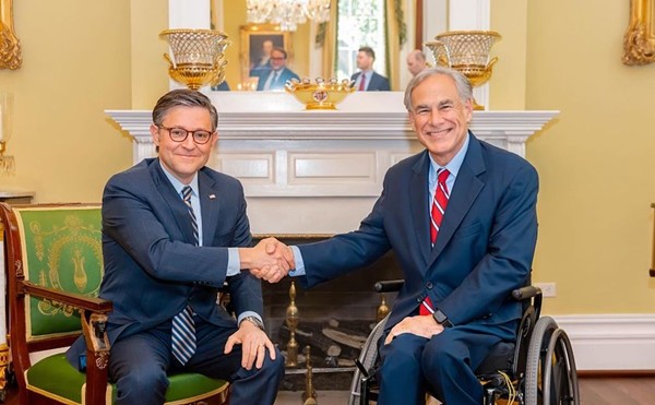 Gov. Greg Abbott shakes the hand of House Speaker Mike Johnson, another GOP politician with an abhorrent record on LGBTQ+ rights.