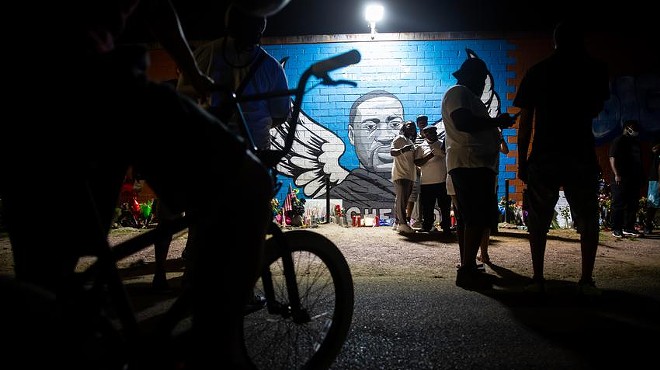 People gather at the mural for George Floyd in Houston’s Third Ward in 2020. The Texas parole board last year recommended pardoning Floyd for a minor drug conviction in Houston, then rescinded that recommendation. On Thursday, the board denied a request for a pardon.