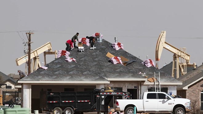 A roofing crew begins to shingle a home under construction in the new Pavilion Park housing development in North Midland on March 14, 2022. Population gains from 2022 to 2023 made Midland the seventh fastest-growing metro area in the country, according to the U.S. Census.