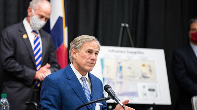 Gov. Greg Abbott makes his squinty face at a press event so people will know he's being tough.