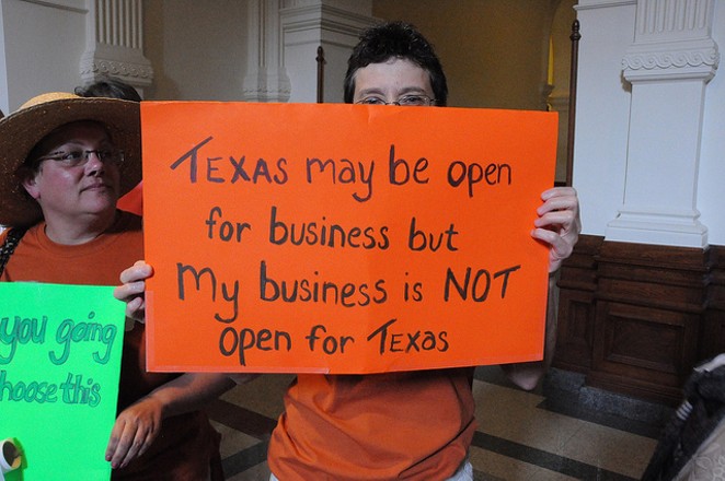 A protestor rallies against abortion restrictions during the previous Legislative session. - VIA FLICKR USER ANN HARKNESS