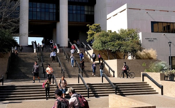 Students walk nearby the Albert B. Allen Library on Texas State University in San Marcos on Jan. 31, 2018.