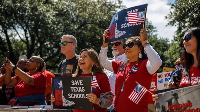 Protesters hold signs and chant during a rally against school vouchers at the Texas Capitol on Oct. 7, 2023. Hundreds gathered to protest two days before a special lawmaking session on vouchers and other topics, slated to begin Monday.
