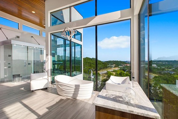 21526 Privada Avila
$3,995,000
This ultramodern second-floor bathroom features a wall of windows with a spectacular view.