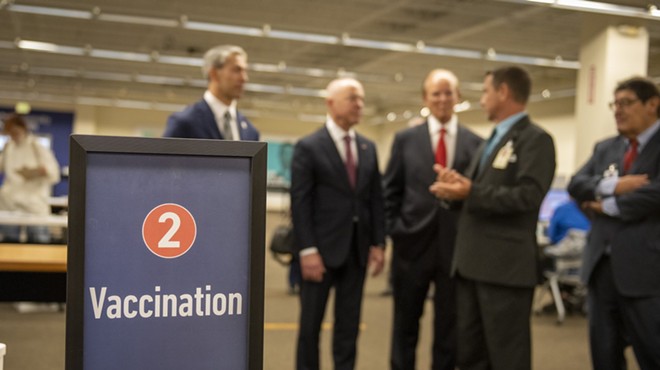 Homeland Security Secretary Alejandro Mayorkas (second from left) tours the mass vaccination site at San Antonio's Wonderland of the Americas mall.