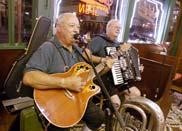 The duo of Rimmie and Bob play German-style music on a recent weekend night at Schilo's Delicatessen. The deli provides live music on Friday and Saturday nights.