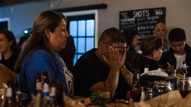 Jerry Mata, whose daughter Tess was one of the 19 students killed at Robb Elementary, rubs his eyes after learning the news that Gov. Greg Abbott was expected to win reelection during a watch party Tuesday at Lunkers Bar and Grill in Uvalde.