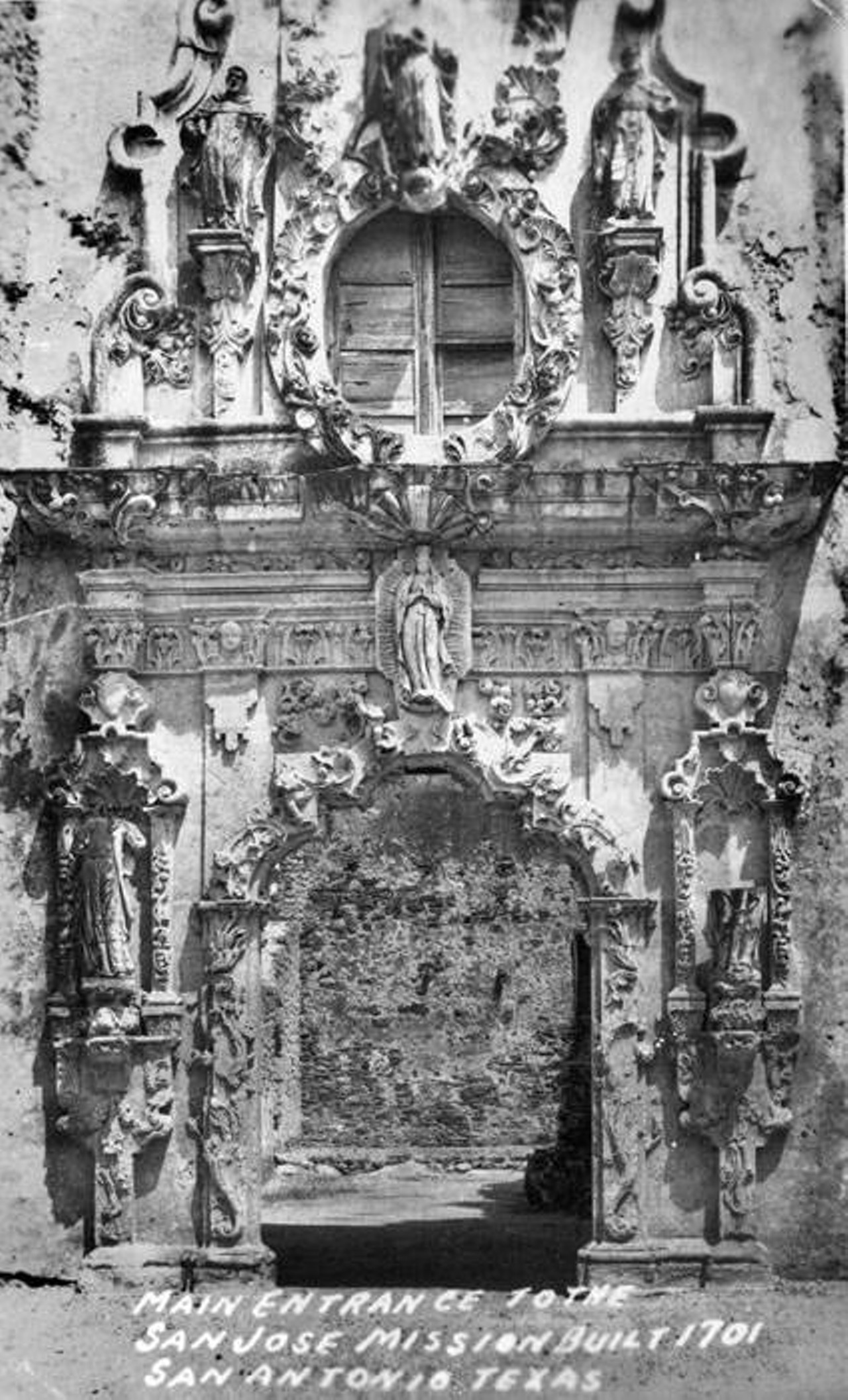 Entrance portal, Mission San Jose, 1920s
Photograph shows a postcard view of the facade of Mission San Jose y San Miguel de Aguayo prior to restoration.