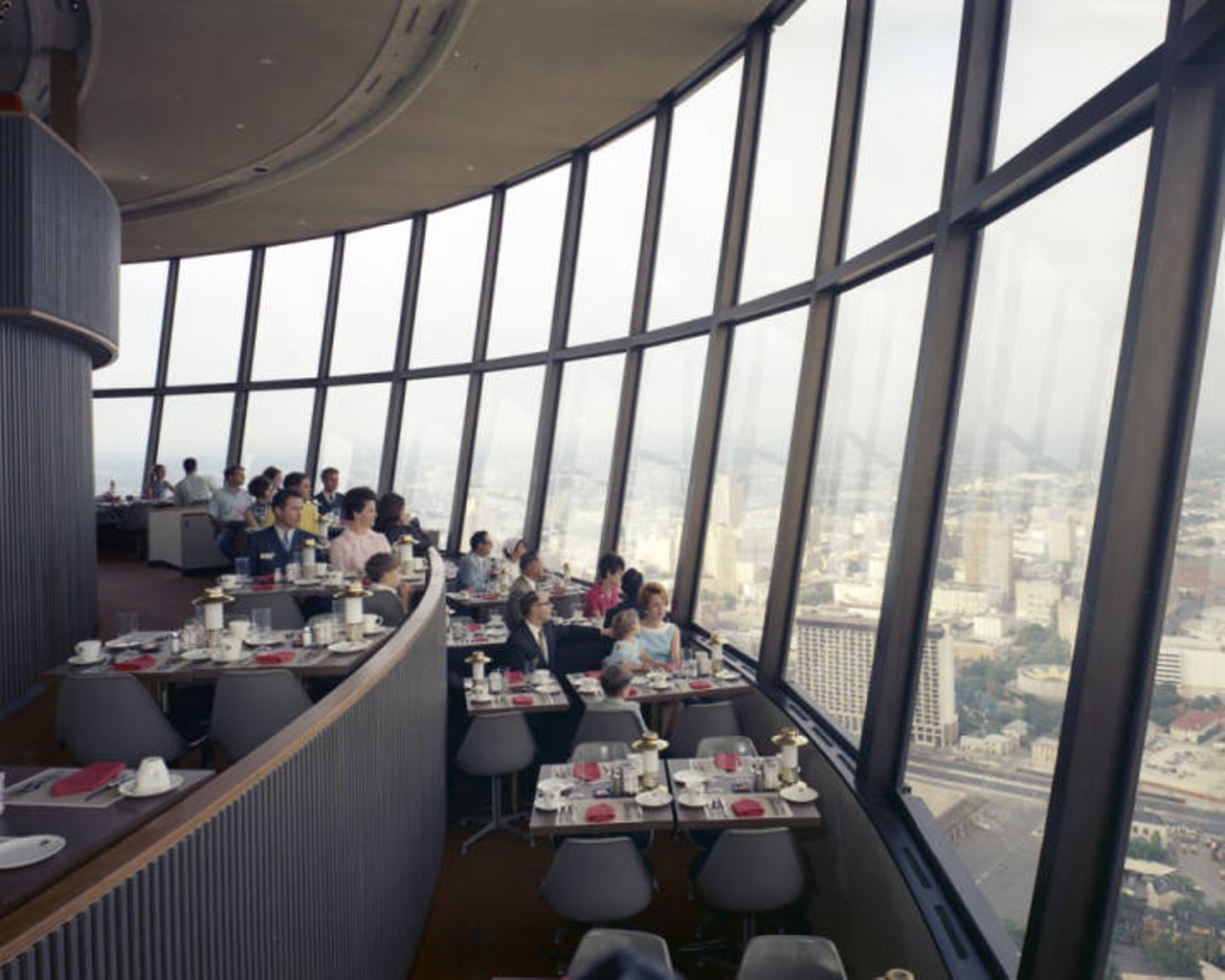 Diners view a panorama of the city from the top of the Tower of the Americas Restaurant