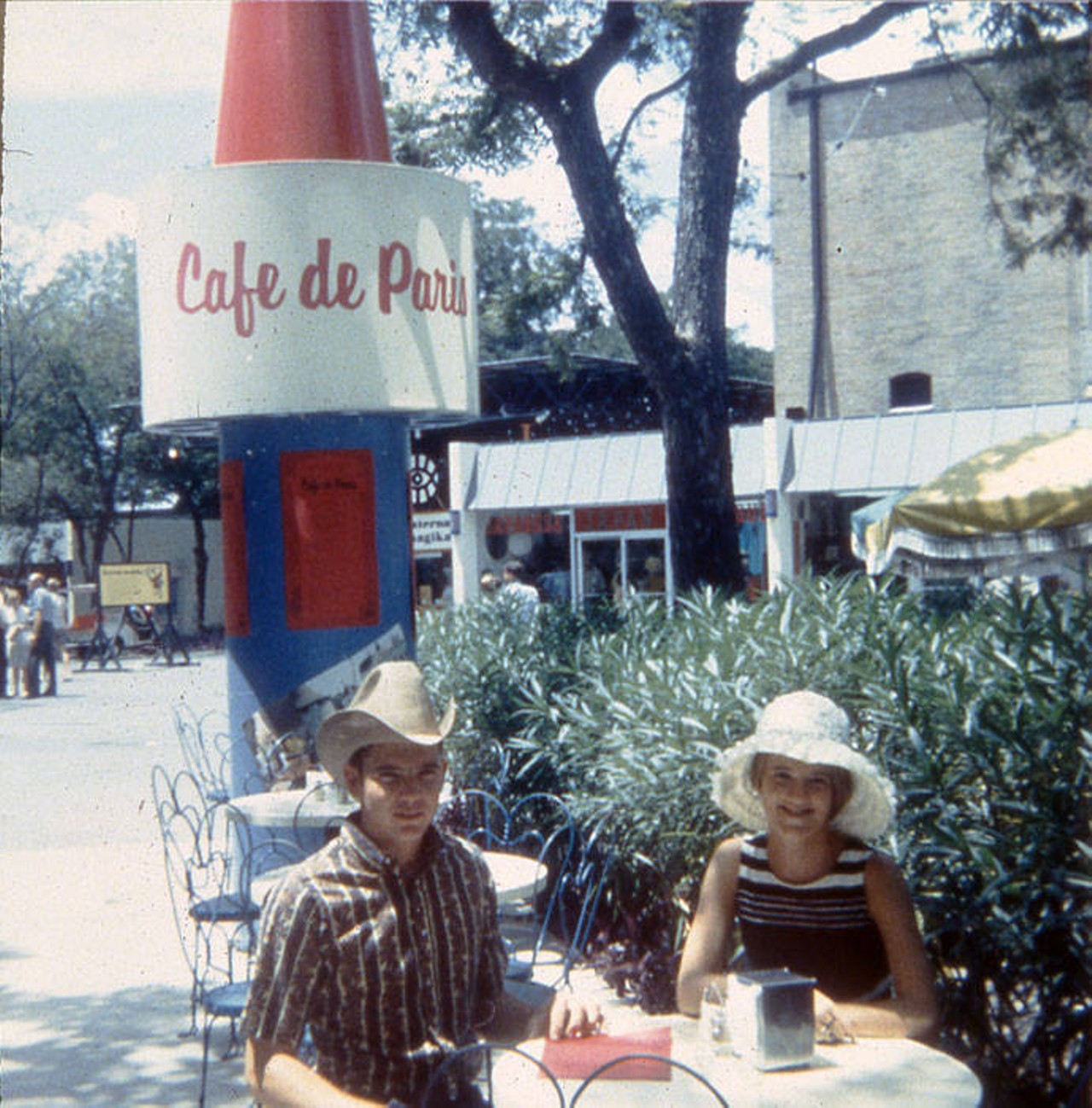 Couple at outdoor dining table at the Cafe de Paris