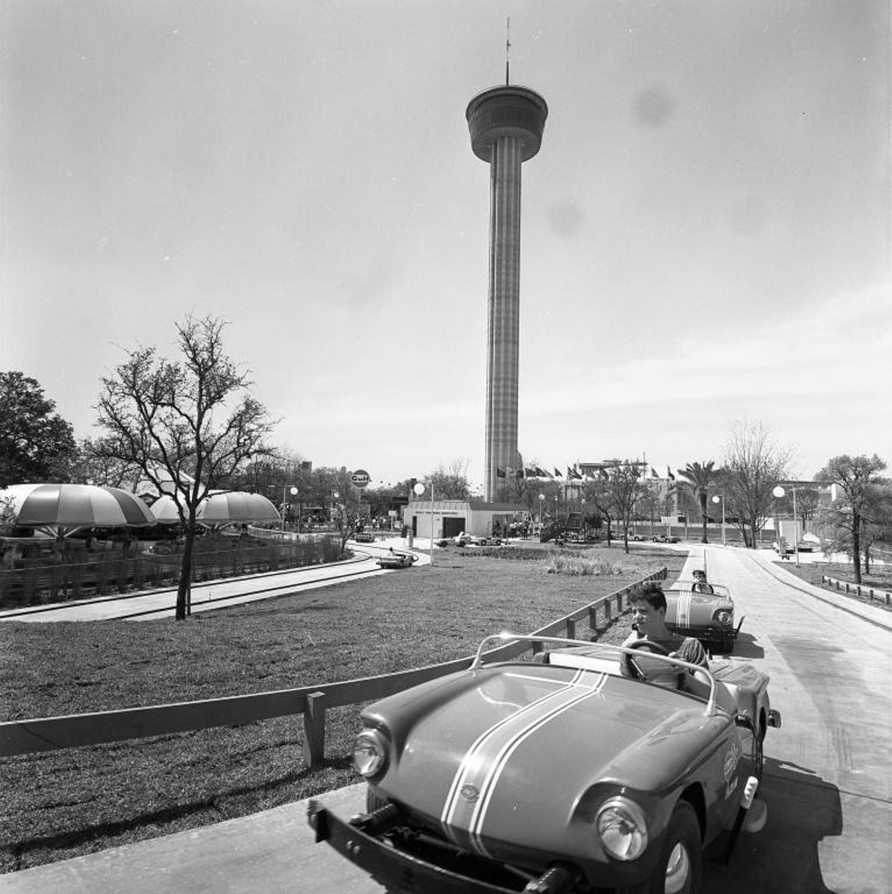 HemisFair '68 Gulf TouRide, gasoline-powered mini sport cars that travel at seven miles per hour over a model freeway with landscaped countryside and traffic controls, sponsored by Gulf Oil Company.