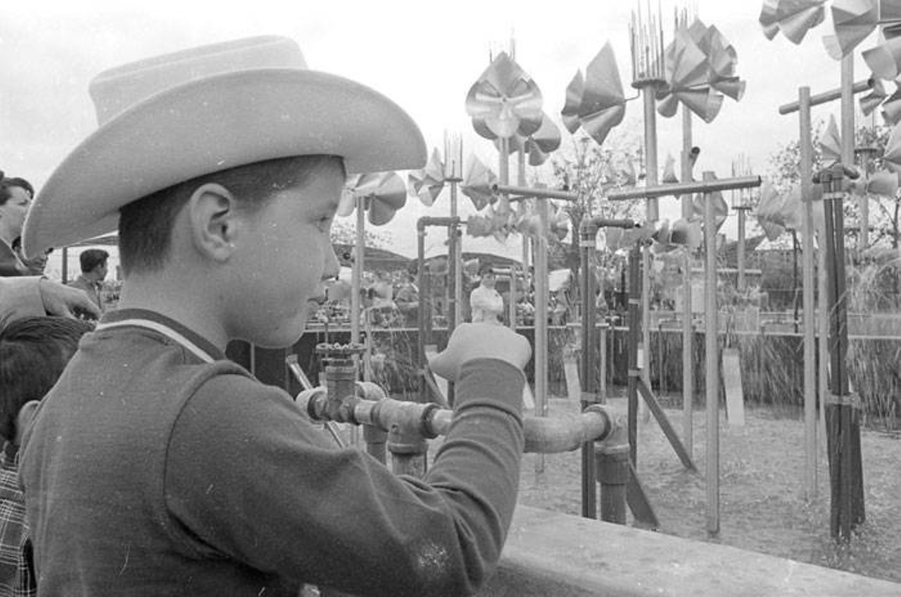 HemisFair'68 visitor regulates the sound of Francois and Bernard Baschet's "A Musical Fountain"