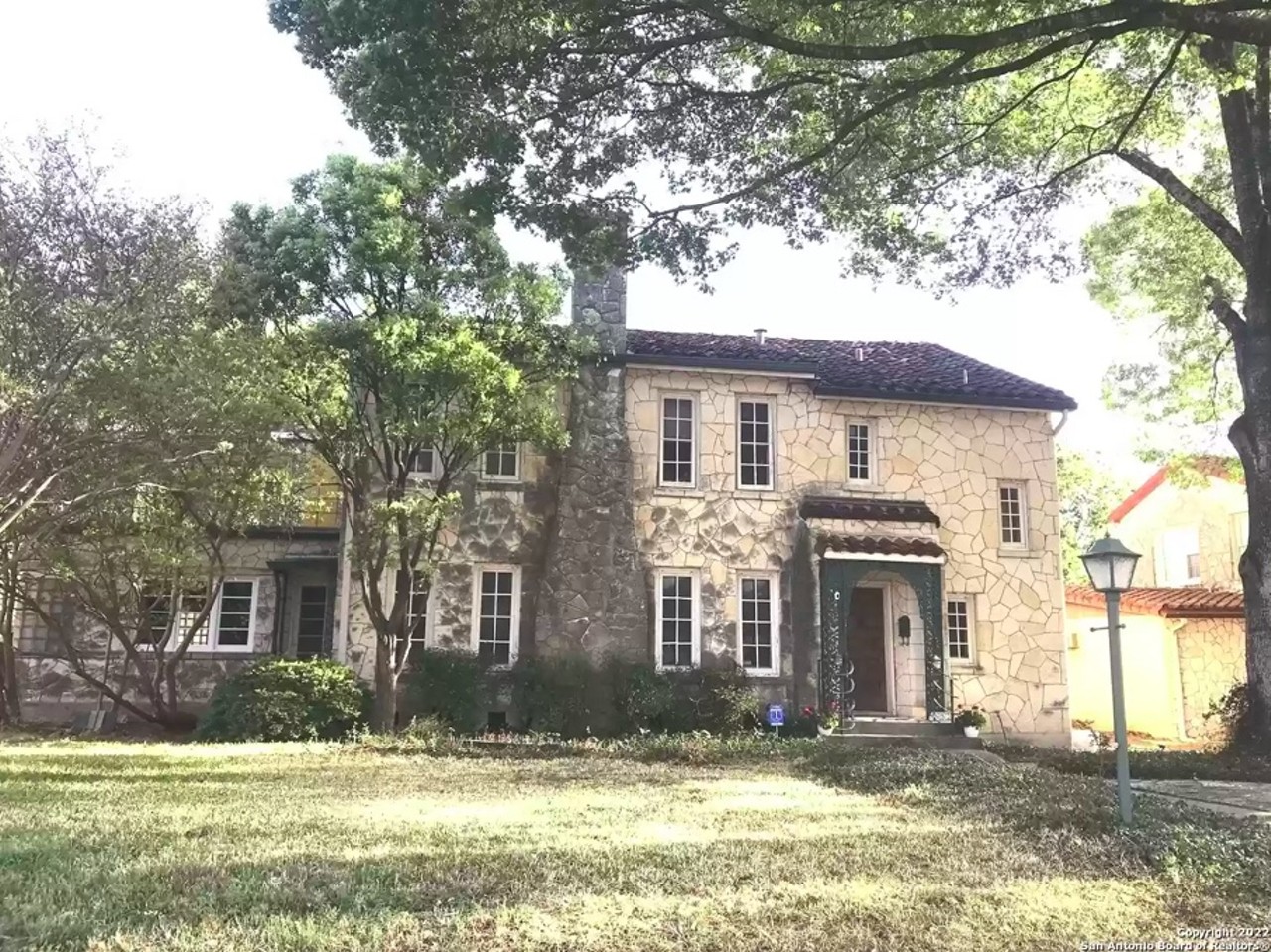 This historic San Antonio home comes with a glass-mosaic ceiling and a bar that looks like a piano