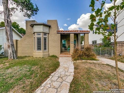 This quaint Spanish-style home for sale in San Antonio is chock full of architectural details