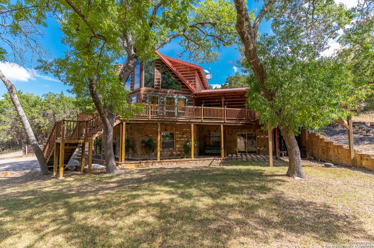 This San Antonio-area log cabin comes with its own on-site hobbit house