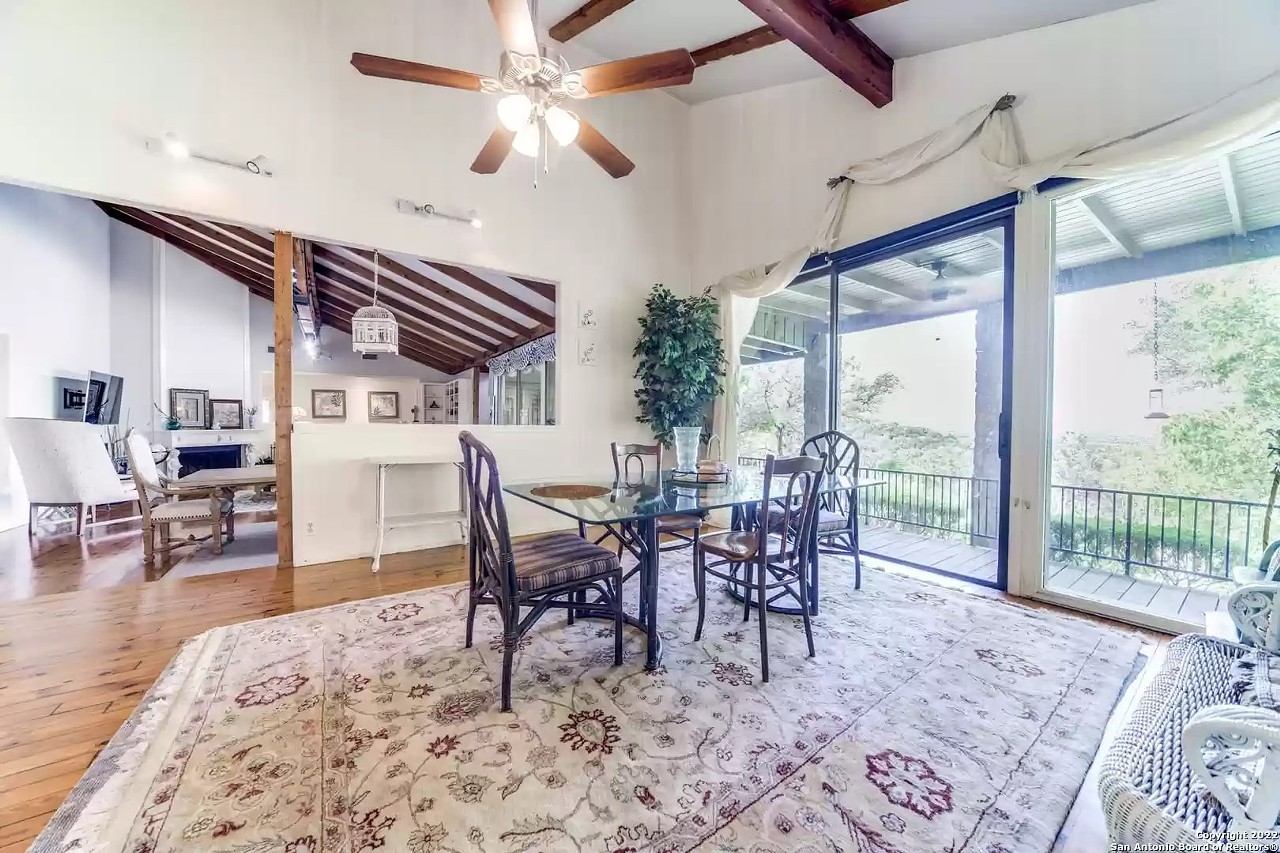 This San Antonio home for sale has a porch swing in its living room, a koi pond and a waterfall