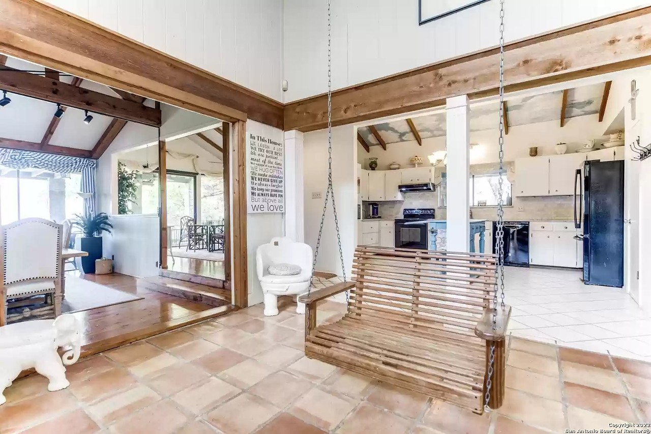 This San Antonio home for sale has a porch swing in its living room, a koi pond and a waterfall
