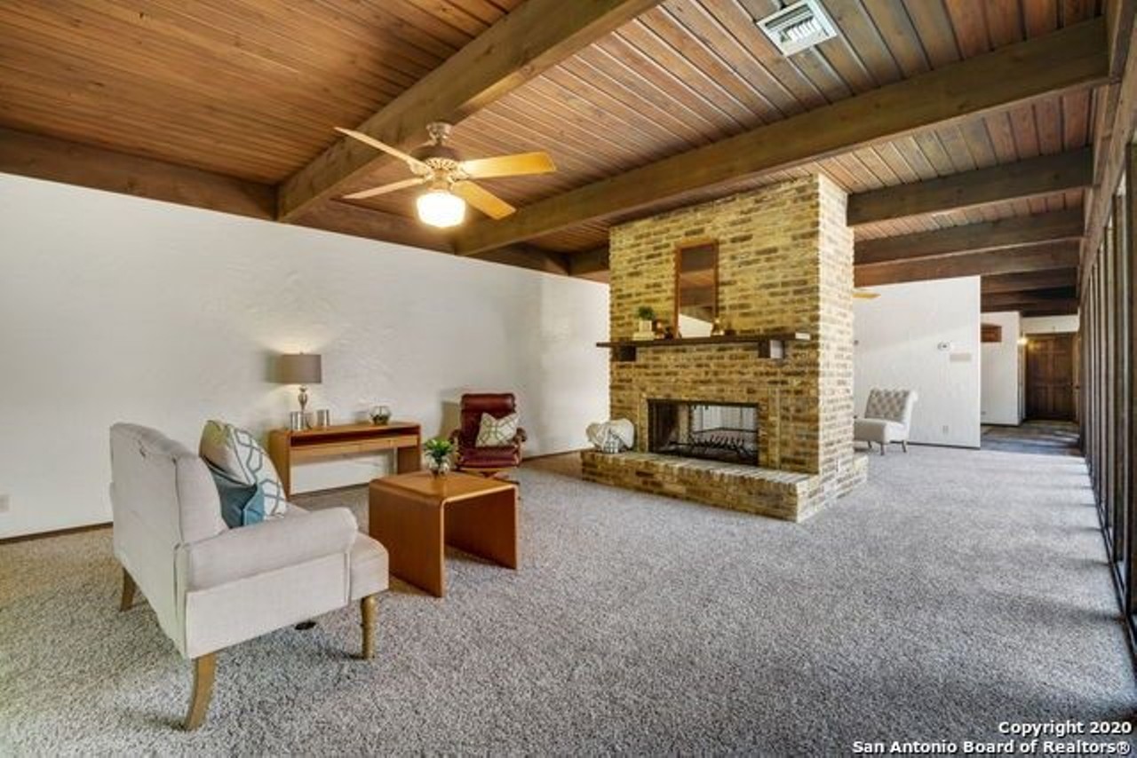 This Santa Fe-Style Home for Sale in San Antonio Has a Central Swimming Pool and Sauna