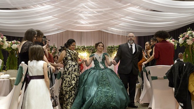 Sienna Raley, flanked by her parents Maria and Troy, begins the Grand Entrance at her quinceañera Saturday, Dec. 16, in Diboll.