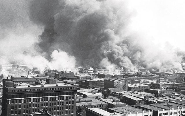 Tulsa’s “Black Wall Street” in flames during a white-on-black riot - COURTESY PHOTO
