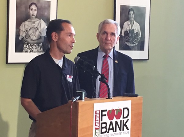 The S.A. Food Bank's Eric Cooper (left) and Rep. Lloyd Doggett discuss the farm bill's proposed cuts to food assistance. - Photo by Sanford Nowlin