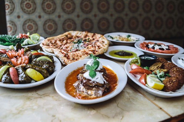 A spread of Pasha’s appetizers, including dolmas, naan, falafel and kashke bademjan, an eggplant dip. - COURTESY OF PASHA
