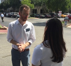 Luke Metzger meets with Whataburger's Karina Alderete in front of the burger chain's corporate office. - SANFORD NOWLIN