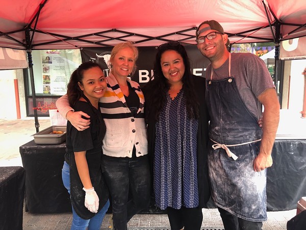 The Southern Grit team (L to R): Gizzelle Mena-Fernandez, Janel Ortega, Elisa Grimes and Michael Grimes takes a moment to pose during the Sunday farmers market at the Pearl. - LEA THOMPSON
