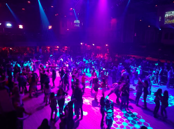 Revelers dance inside Cowboys Dancehall. - Instagram / cowboysdancehallsa