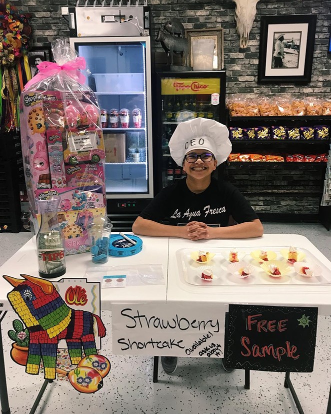 Sarita Hernandez, the youngest member of the Hernandez family, invites customers to enter the business' Easter raffle. - COURTESY