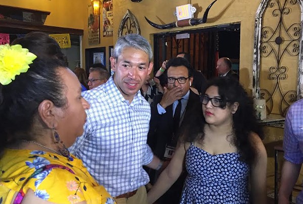 Ron Nirenberg meets with supporters during his Saturday night election watch party. - SANFORD NOWLIN