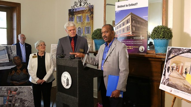 San Antonio Conservation Society President Susan W. Beavin (from left); Vincent L. Michael, executive director of the San Antonio Conservation Society; and local architect Everett Fly speak at a press conference at the Dashiell House at La Villita on Tuesday. - BEN OLIVO