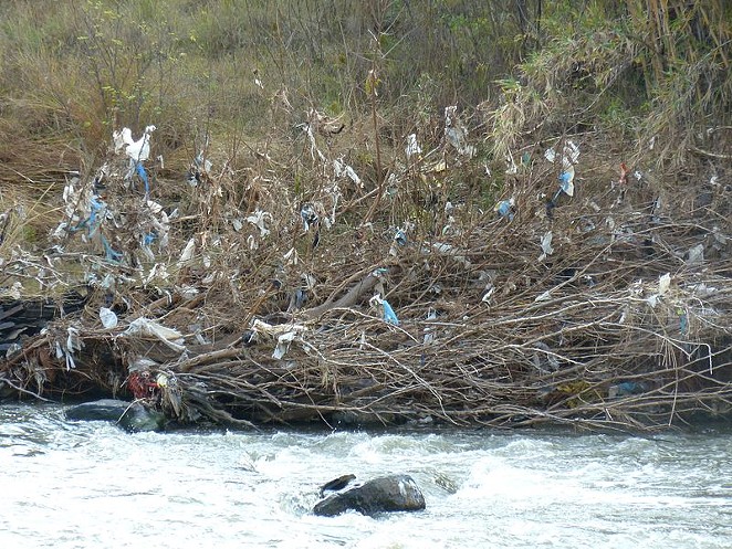 The effect of plastic bag pollution on a river. - Wikimedia Commons