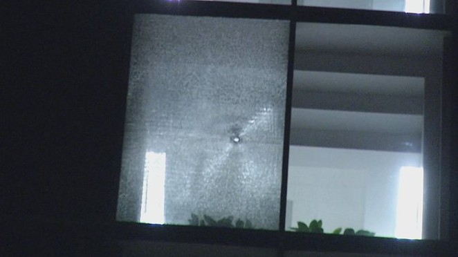 Shots shattered windows at a pair of buildings housing ICE offices in San Antonio early Tuesday morning. - Twitter / DLoesch