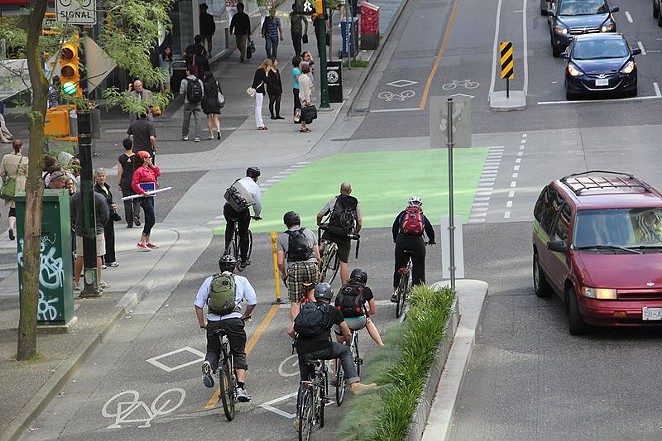 Protected bike lanes, such as these in Vancouver, include a median to keep cars out. - WIKIMEDIA