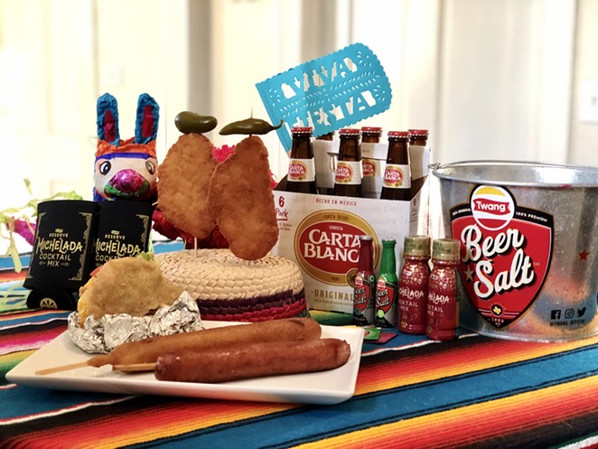 The NIGHT IN OLD SQZBOX party packs include Fiesta favorites such as chicken on a stick, gorditas, footlong sausages and footlong corndogs. - COURTESY PHOTO / SQUEEZEBOX