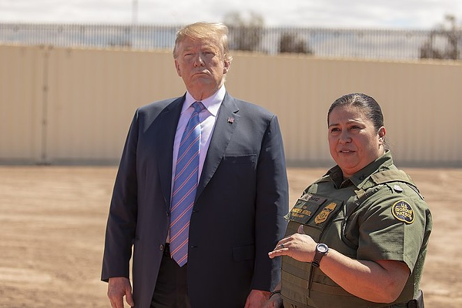President Trump visits the U.S.-Mexico border last year. A lawsuit accuses his administration of stifling the free speech of immigration judges. - CBP PHOTOGRAPHY
