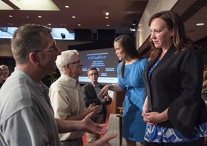 MJ Hegar (right) speaks with audience members after a 2018 political forum. - WIKIMEDIA COMMONS / JAY GODWIN