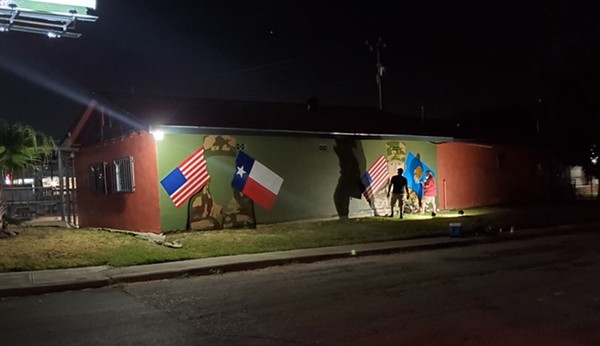 Local artist Ghost works through the night to complete a tribute mural in honor of deceased US Army soldiers Guillen and  Morales. - COURTESY CIRCLE OF ARMS