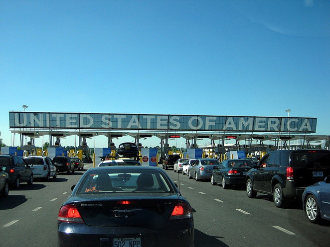 Cars line up to pass in to the U.S. - VIA FLICKR USER MPD01605