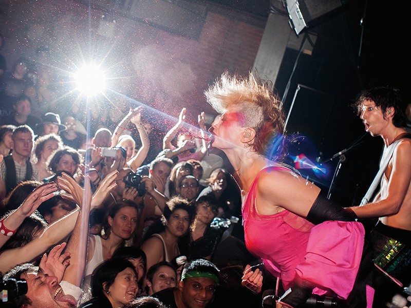 Peaches spraying the crowd with fake blood in Brooklyn in 2009. - COURTESY